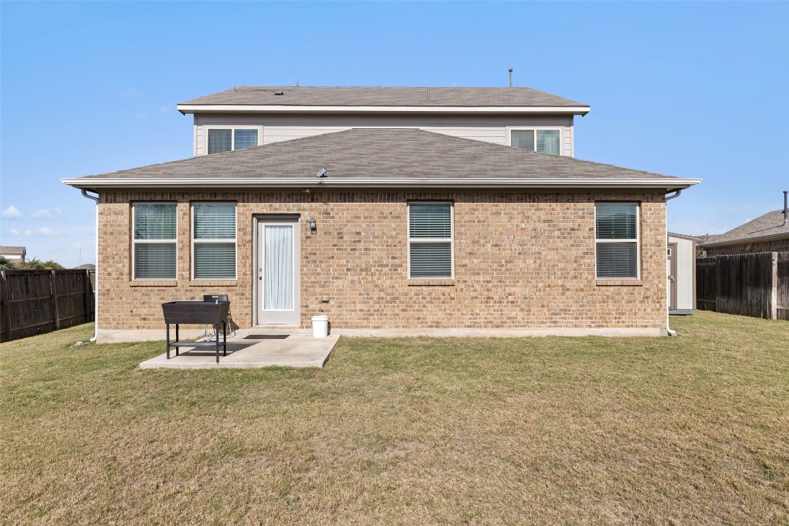 11701 Pecangate Way Manor, TX 78653 - Photo 36 of 40 a front view of a house with a yard