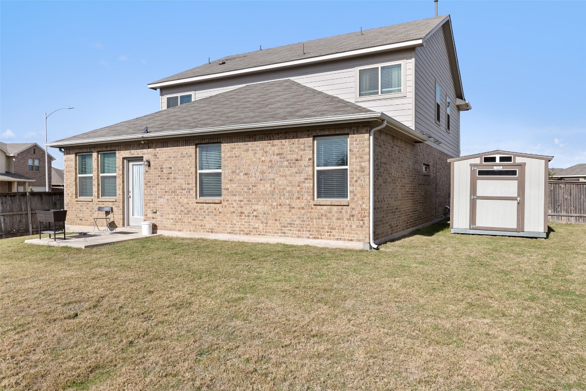 11701 Pecangate Way Manor, TX 78653 - Photo 37 of 40 a house that has a lot of windows in it