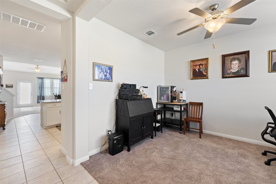 11701 Pecangate Way Manor, TX 78653 - Photo 7 of 40 a view of a workspace with furniture and a workspace