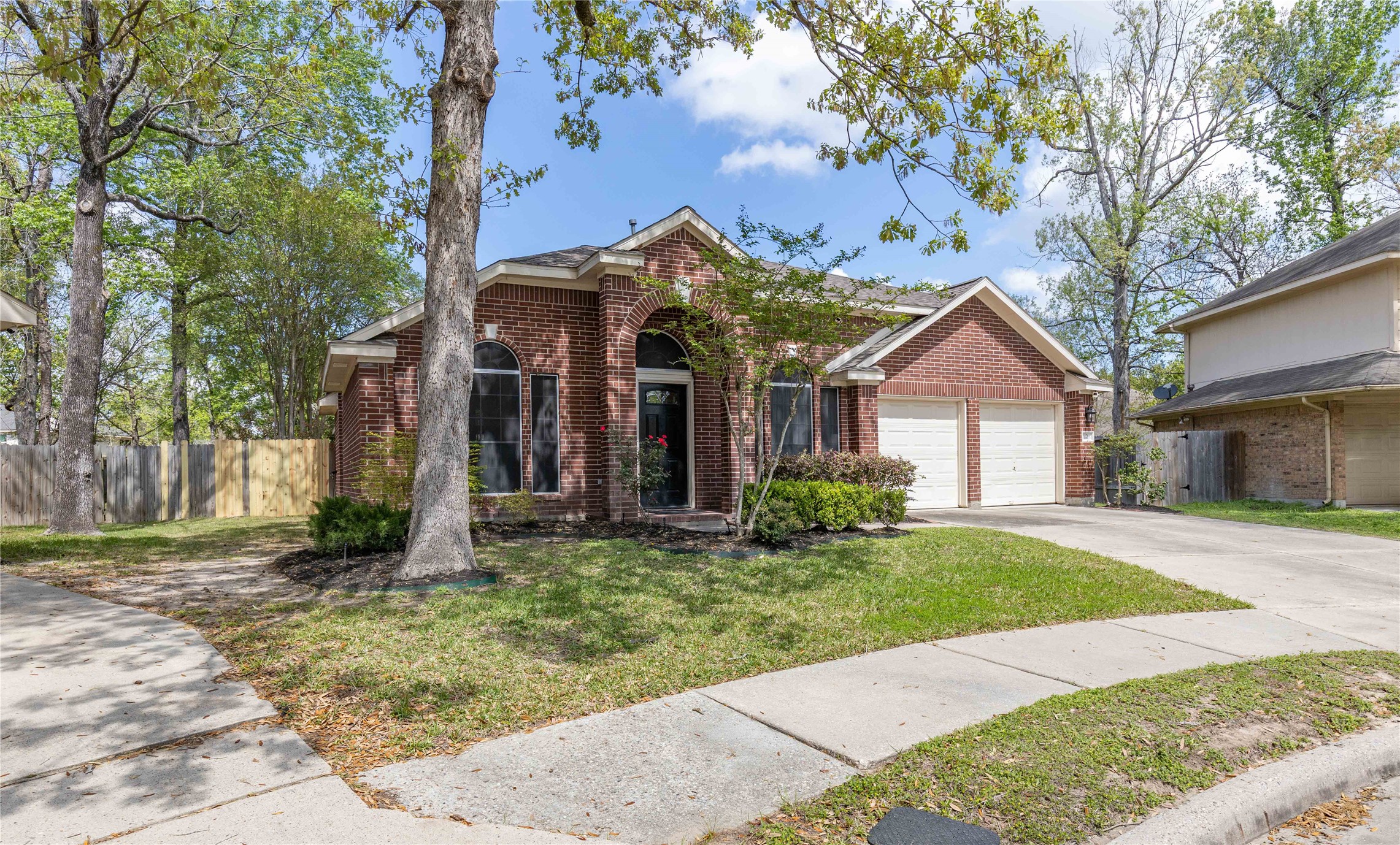 1707 Moston Drive Spring, TX 77386 - Photo 41 of 41 a front view of a house with a yard and garage