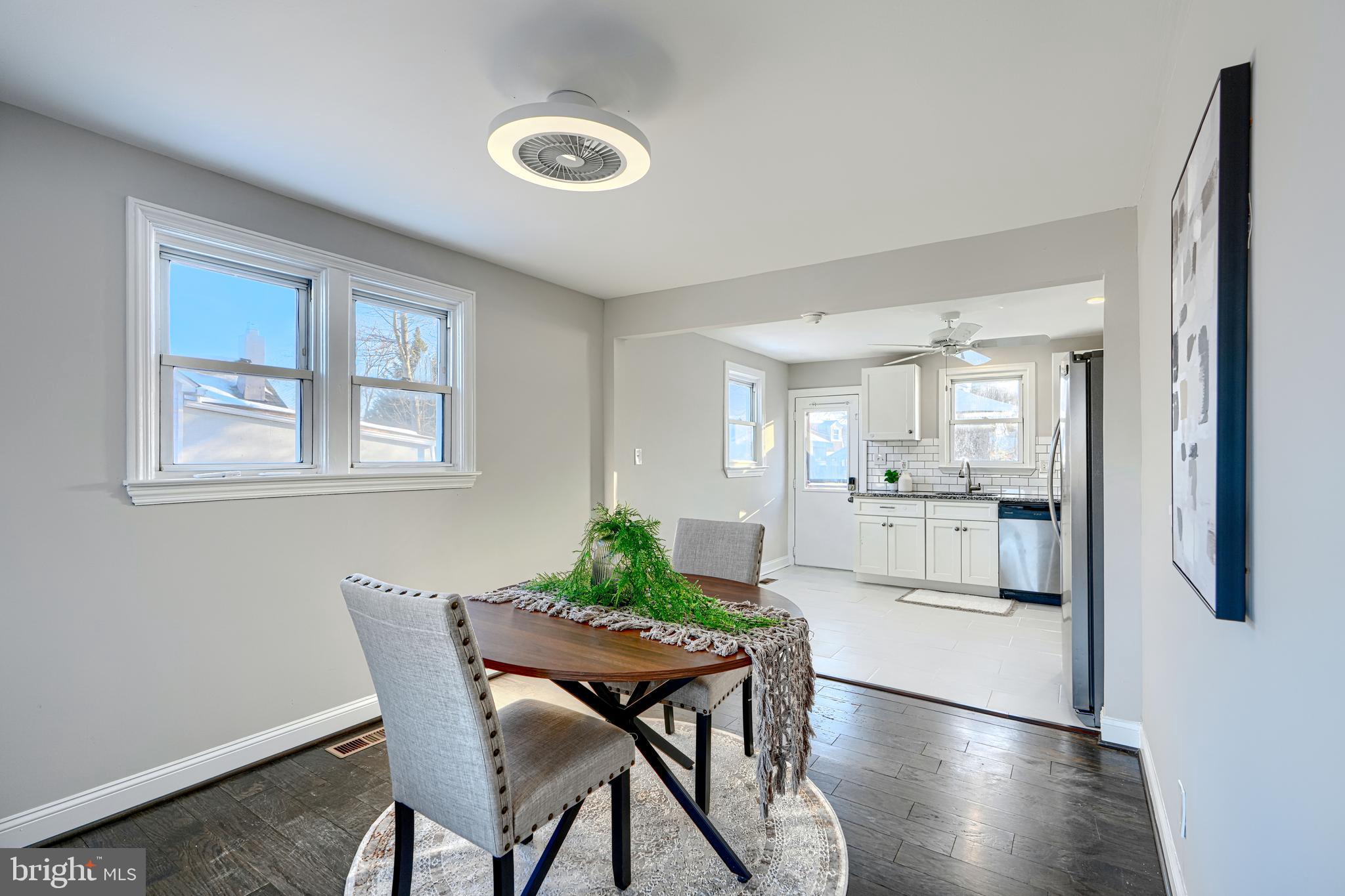 1203 Hilldale Road Baltimore, MD 21237 - Photo 11 of 55 a view of a dining room with furniture and wooden floor