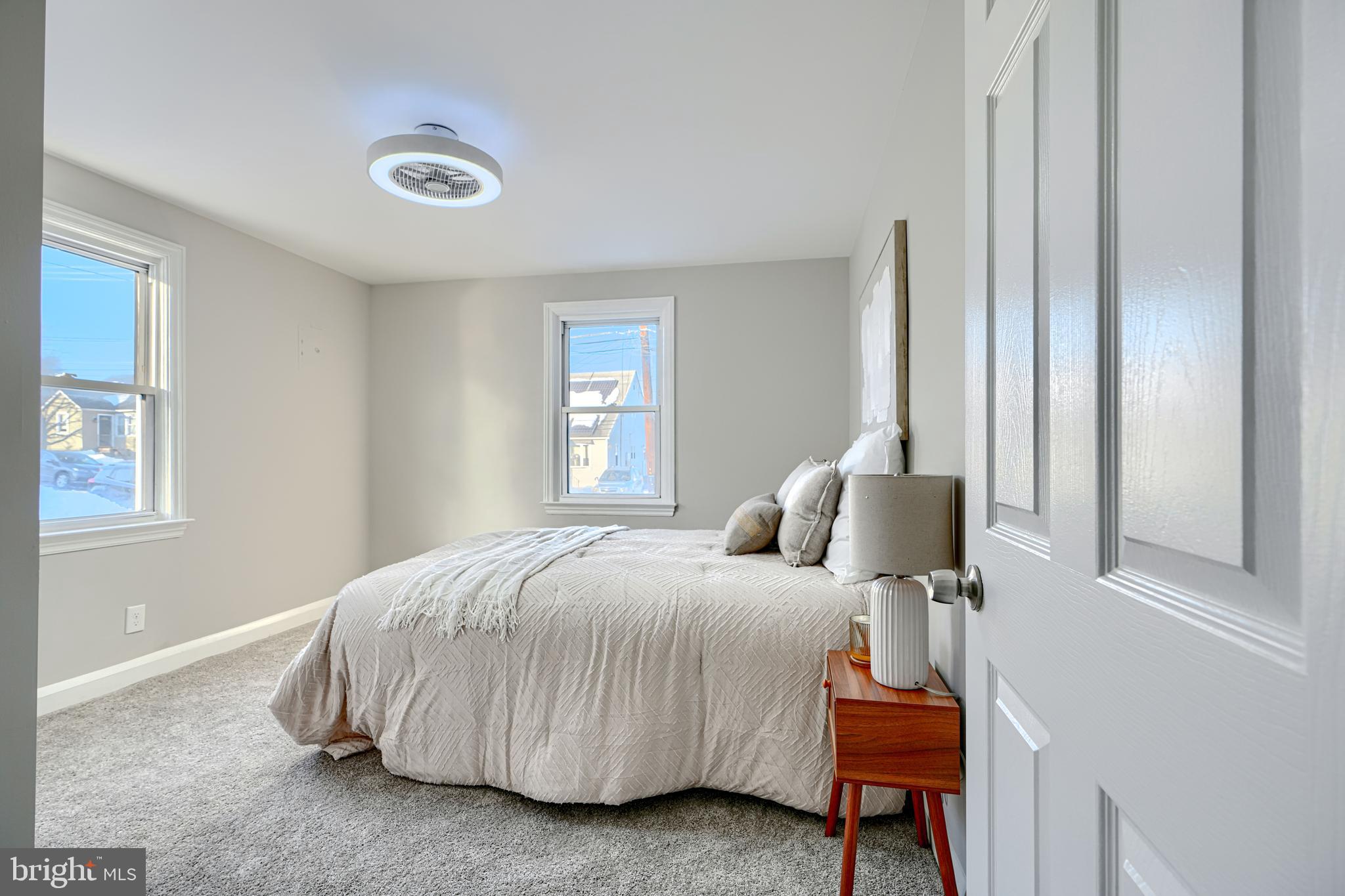 1203 Hilldale Road Baltimore, MD 21237 - Photo 17 of 55 a bedroom with a bed and window