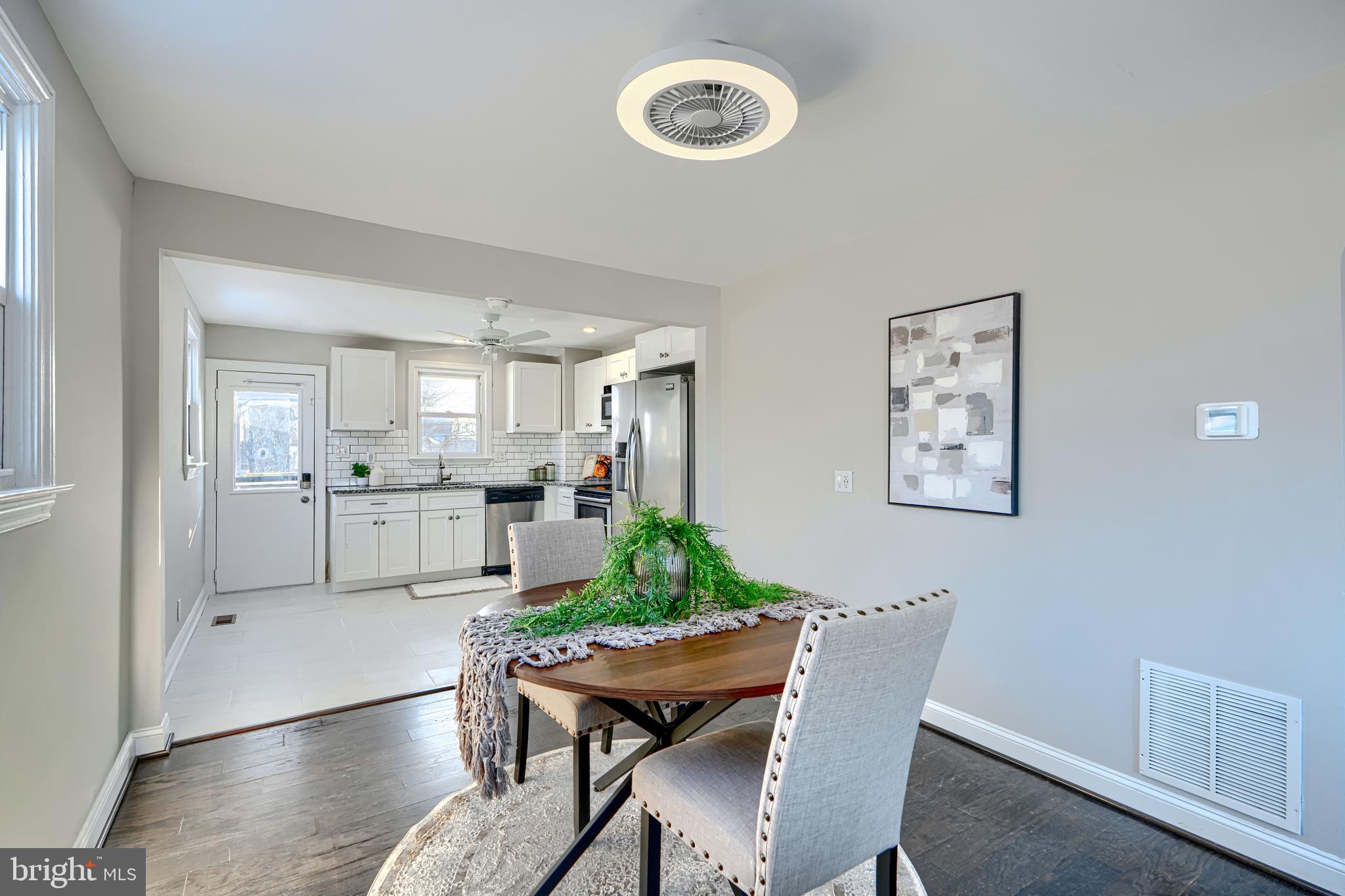 1203 Hilldale Road Baltimore, MD 21237 - Photo 10 of 55 a living room with furniture and view of kitchen