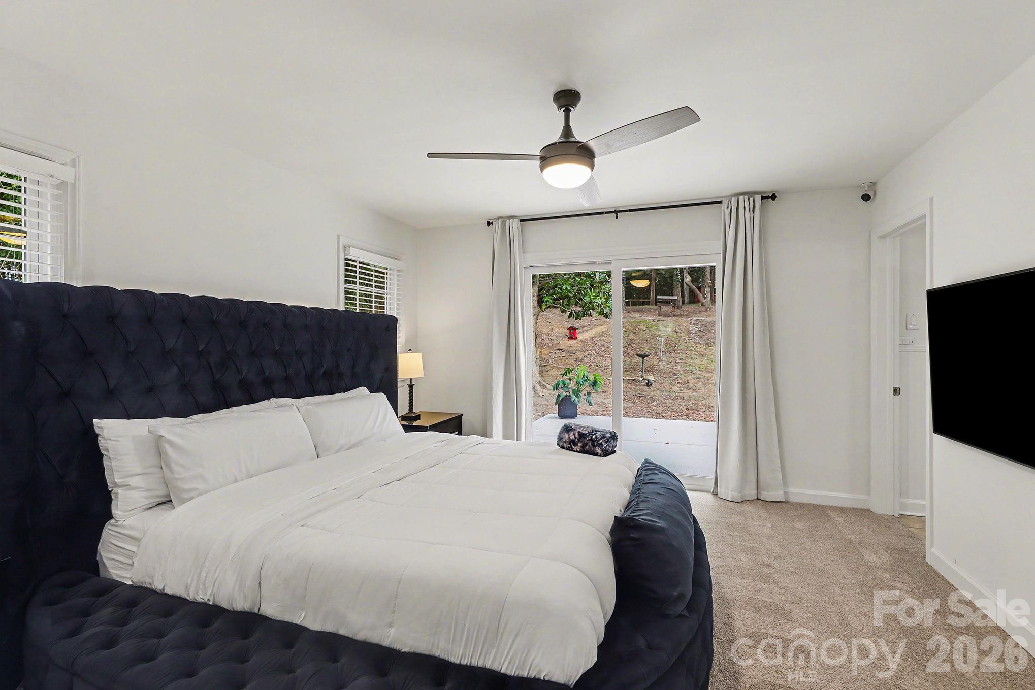 123 Old Bell Road Charlotte, NC 28270 - Photo 17 of 46 a bedroom with a large bed and a flat screen tv