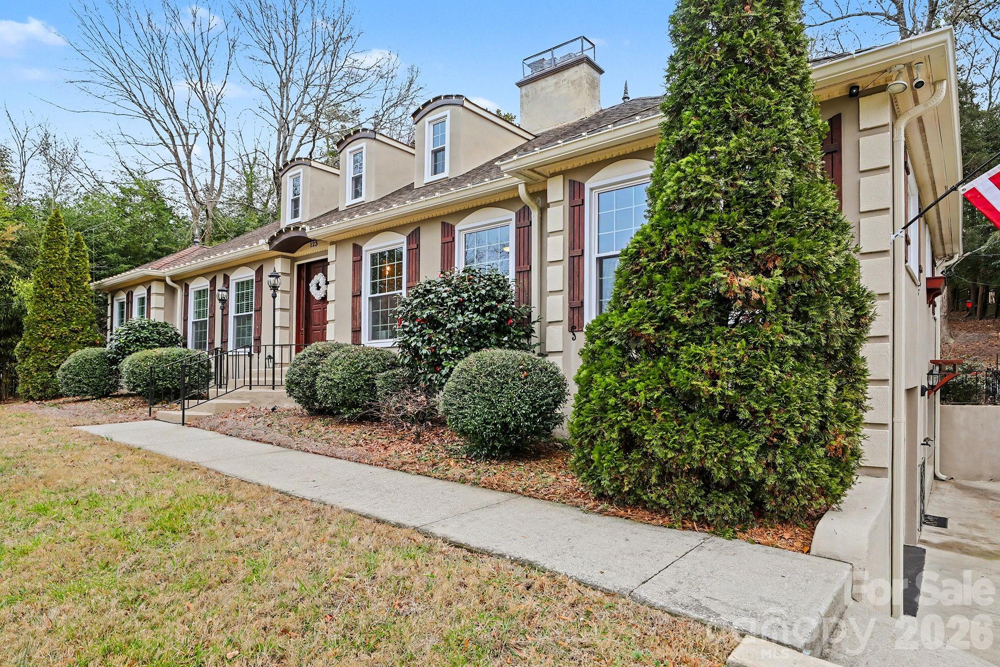 123 Old Bell Road Charlotte, NC 28270 - Photo 2 of 46 a front view of a house with a yard