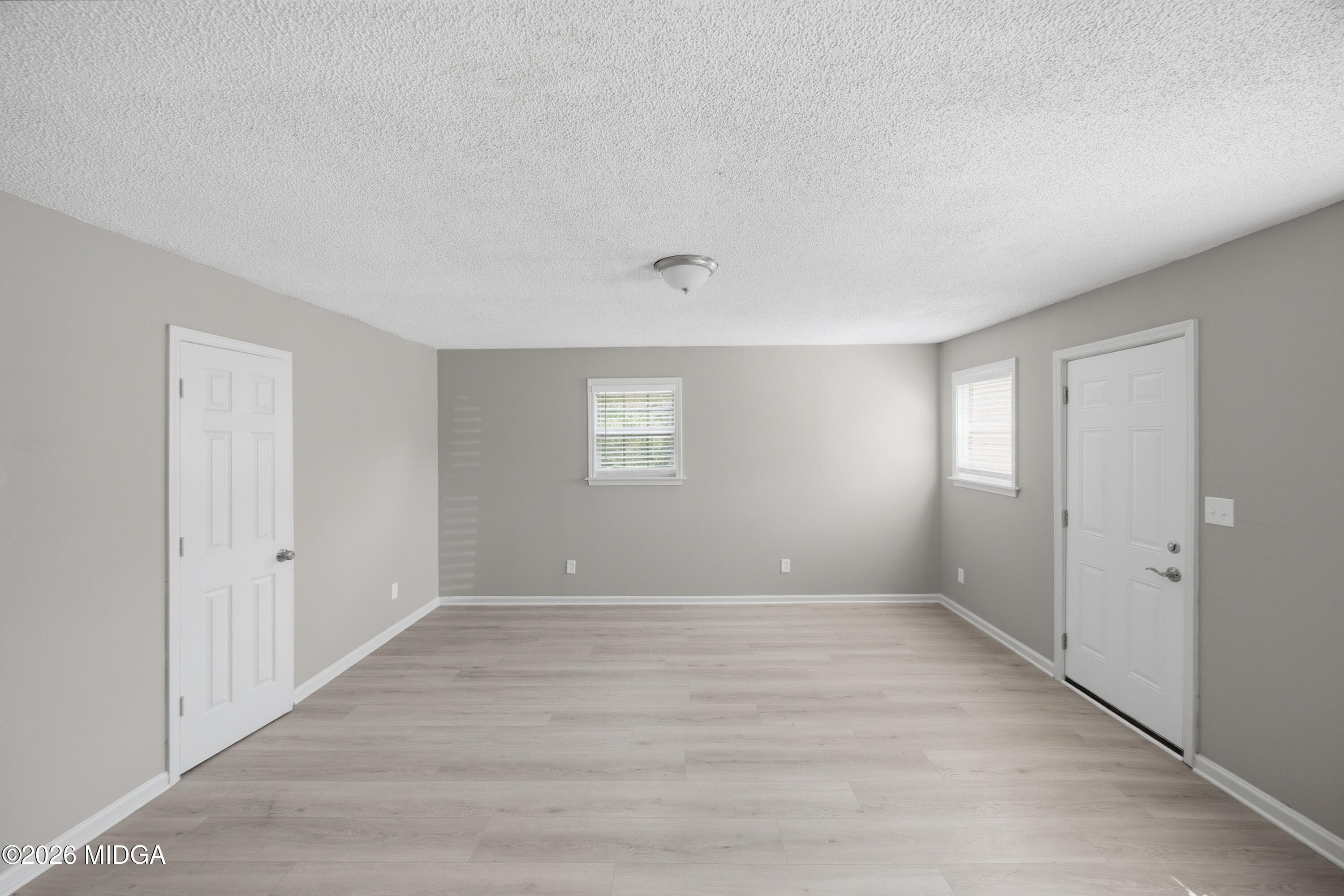 427 Gun Club Road Fort Valley, GA 31030 - Photo 16 of 26 a view of an empty room with a window