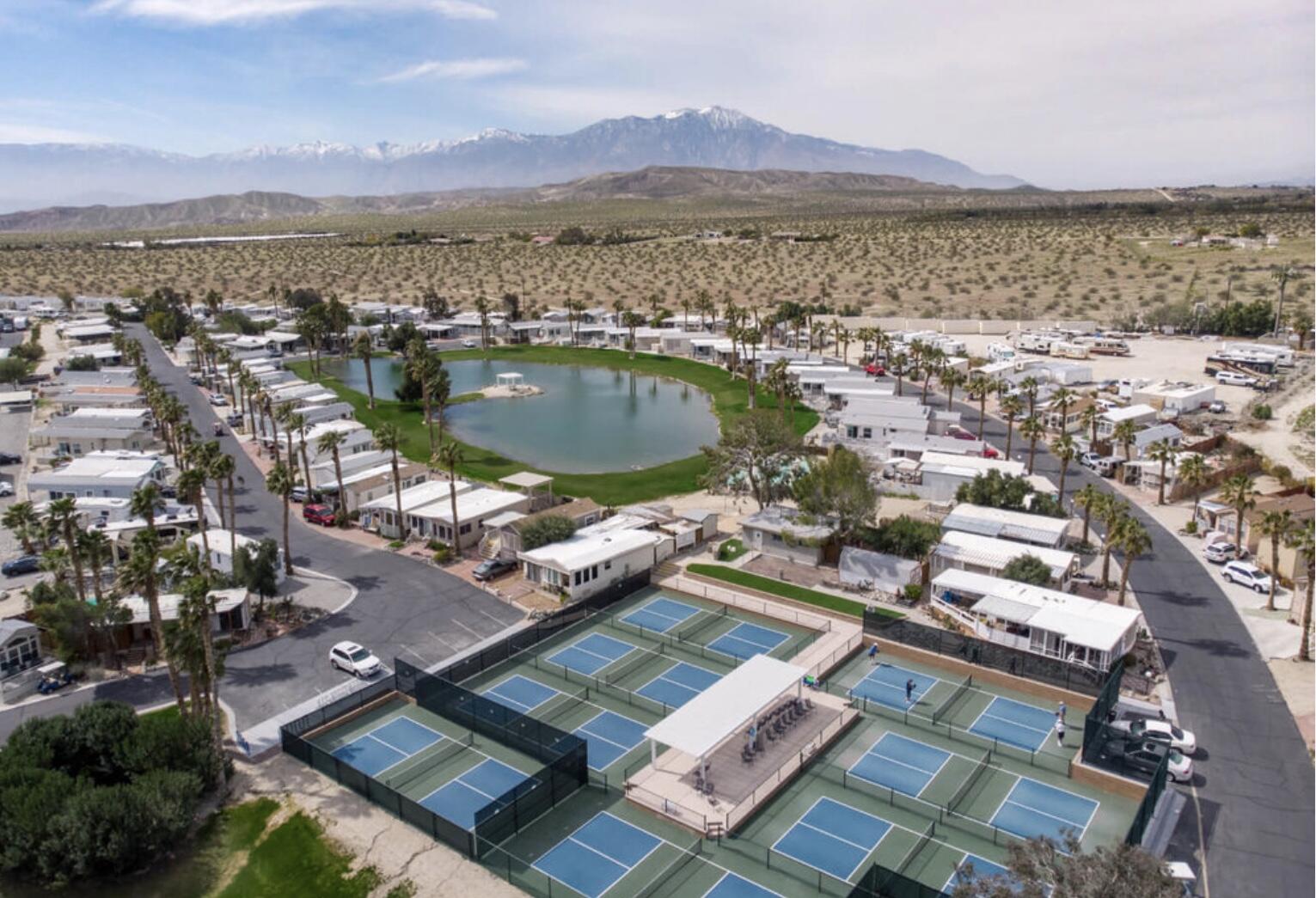 74711 Dillon Road Desert Hot Springs, CA 92241 - Photo 39 of 44 an aerial view of residential houses with outdoor space and ocean view