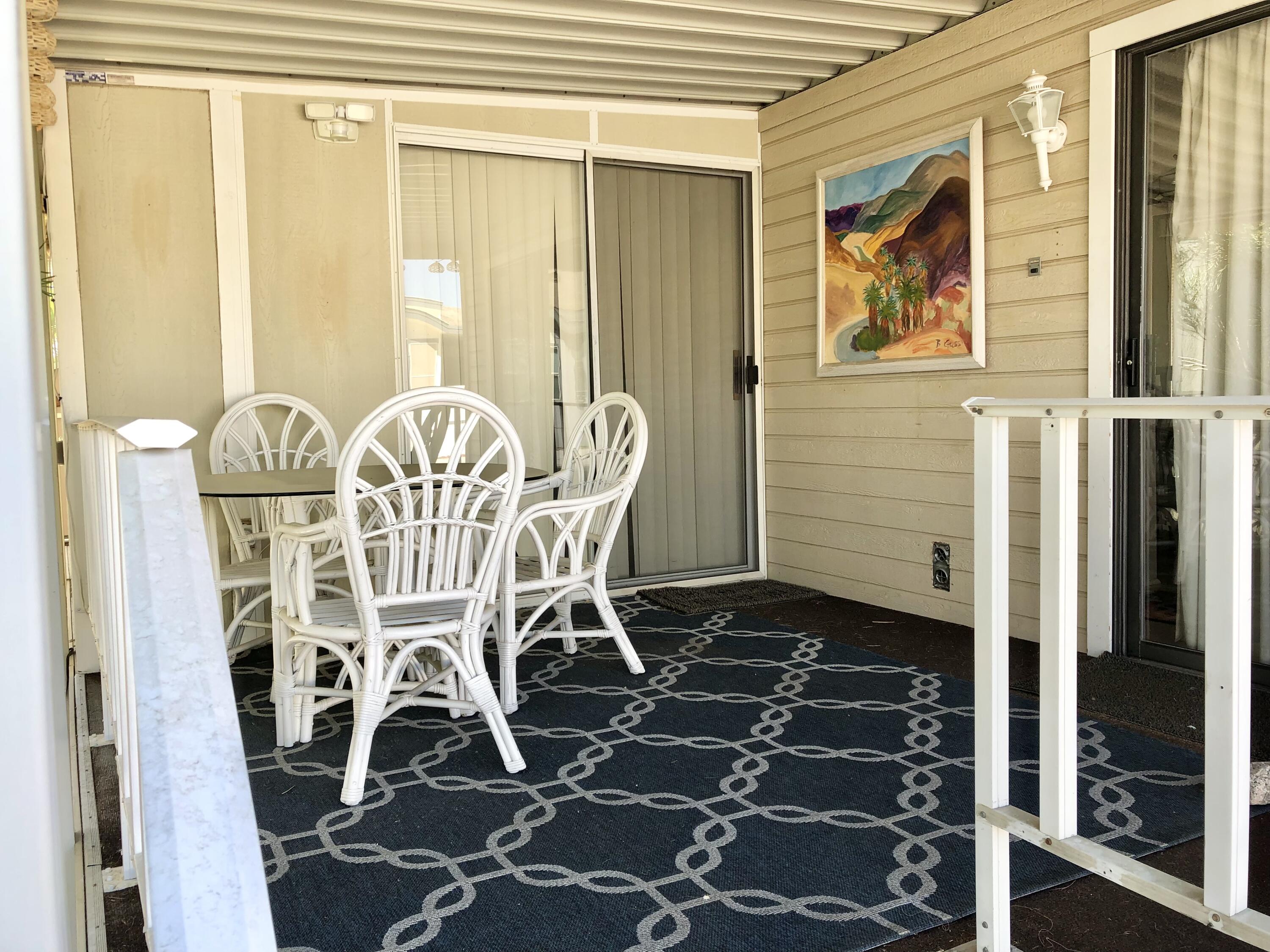 74711 Dillon Road Desert Hot Springs, CA 92241 - Photo 5 of 44 a view of a dining room with furniture and a window