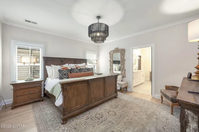 a bed room with a bed and a window