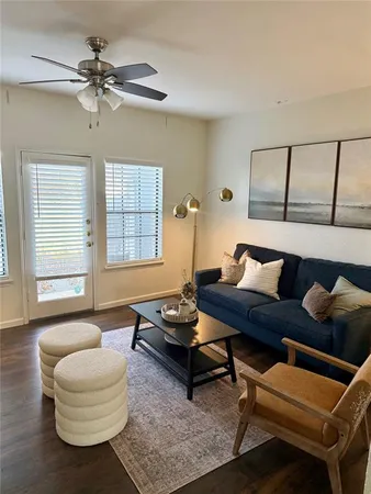 a living room with furniture and a window