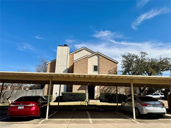 a view of a car parked in front of a building