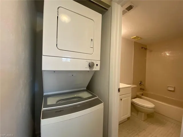 a bathroom with a toilet and a sink