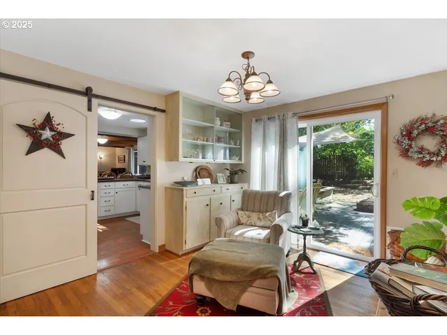 a view of a livingroom with furniture window and wooden floor