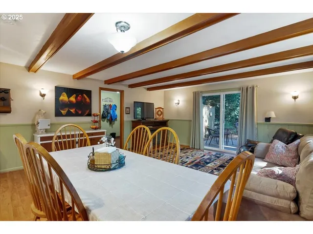a outdoor living space with furniture and a flat screen tv