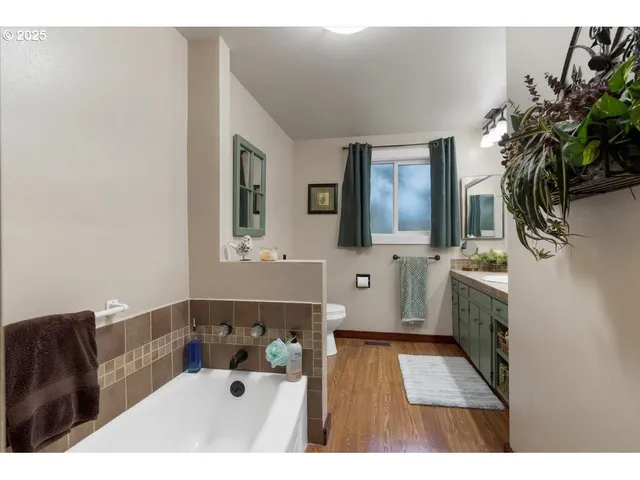 a bathroom with a sink a mirror and a toilet