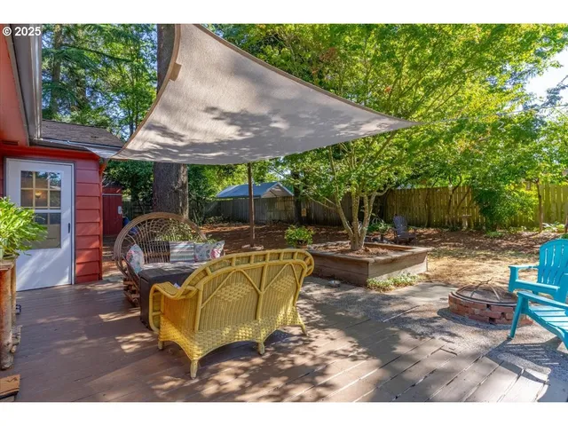 a view of backyard with swimming pool and patio