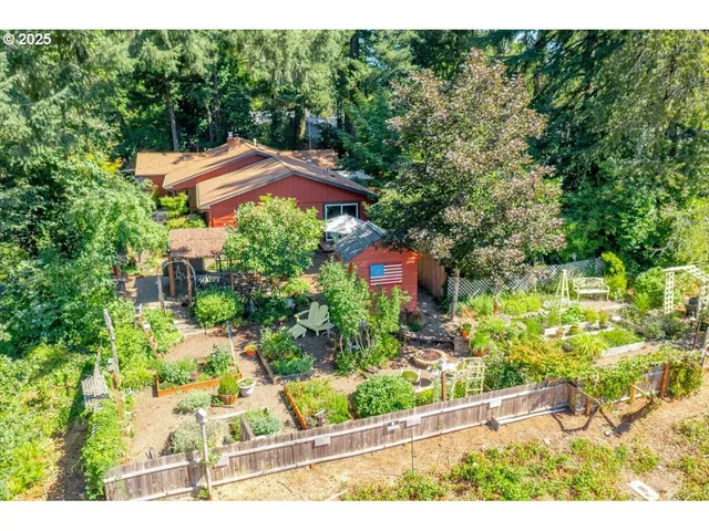 a view of a garden with an outdoor seating