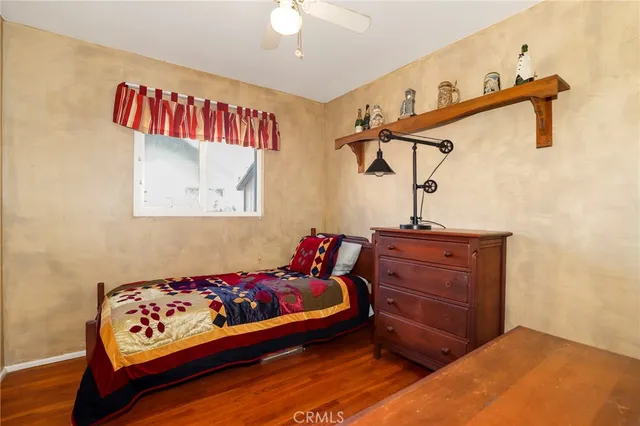 a bed room with a bed and a dresser