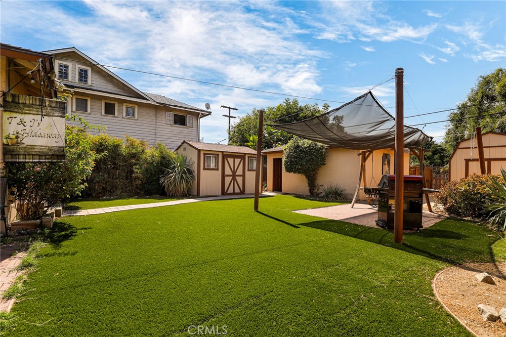 576 East Columbia Avenue Pomona, CA 91767 - Photo 21 of 27 a front view of a house with garden