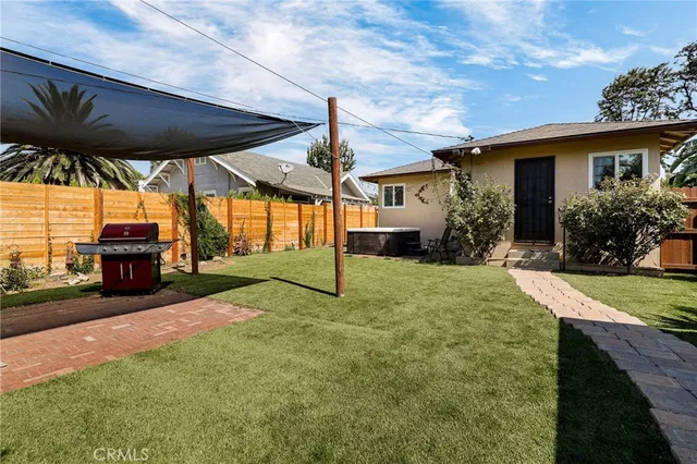 a view of a house with backyard and porch