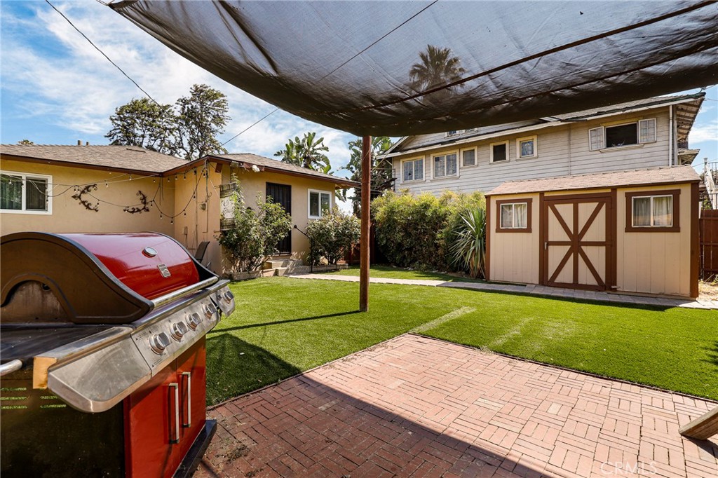 576 East Columbia Avenue Pomona, CA 91767 - Photo 25 of 27 a front view of a house with garden
