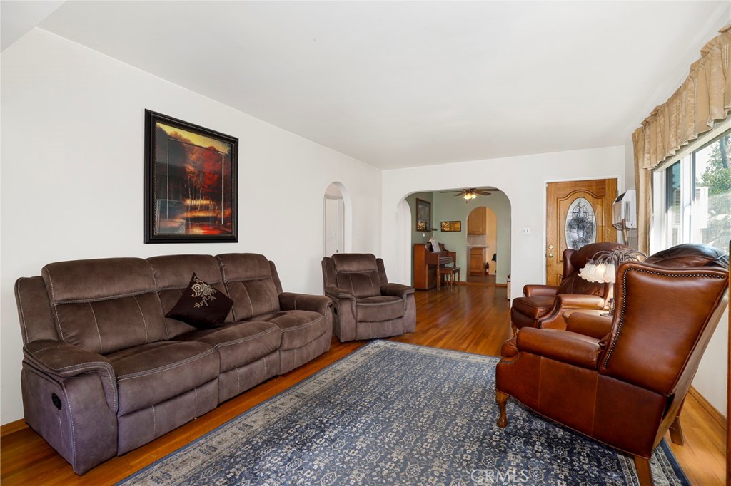 576 East Columbia Avenue Pomona, CA 91767 - Photo 6 of 27 a living room with furniture and a painting