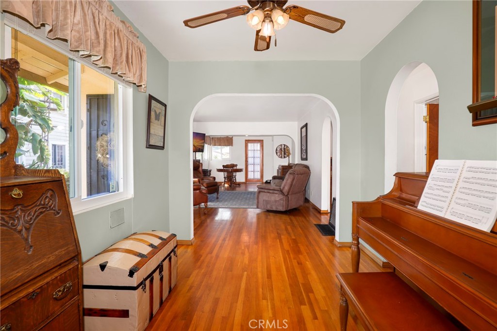 576 East Columbia Avenue Pomona, CA 91767 - Photo 9 of 27 a living room with furniture and a wooden floor