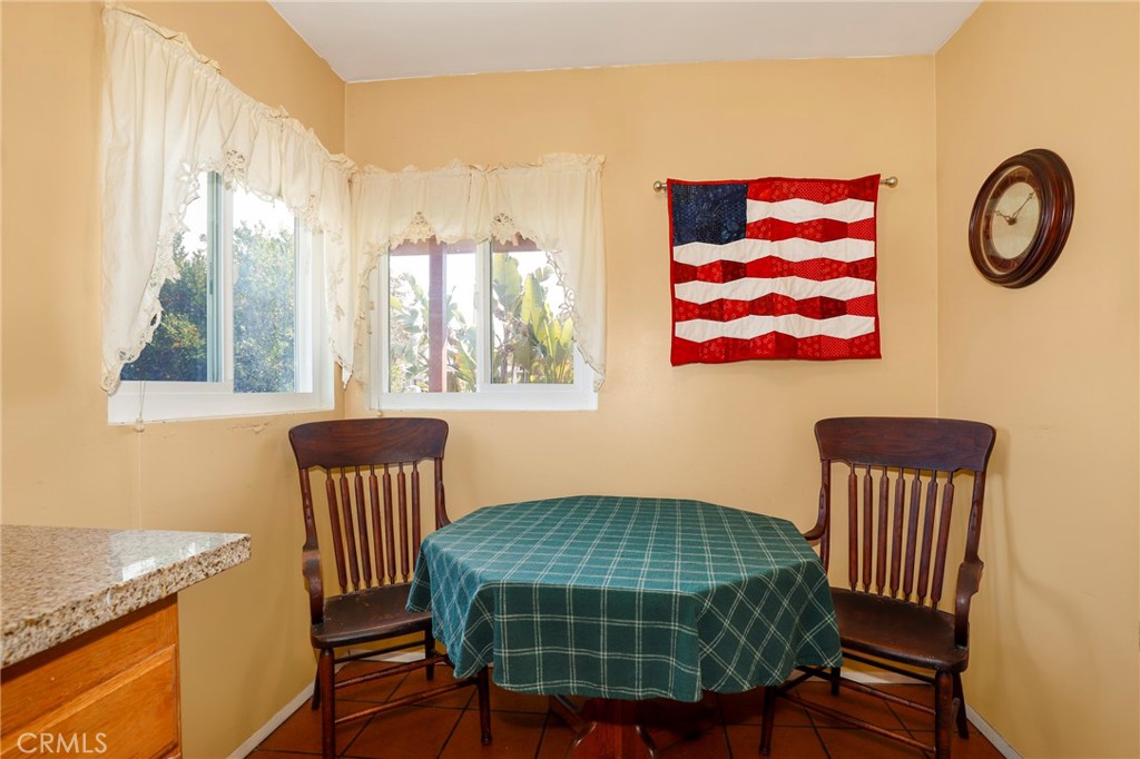 576 East Columbia Avenue Pomona, CA 91767 - Photo 10 of 27 a bedroom with a table chair and a window