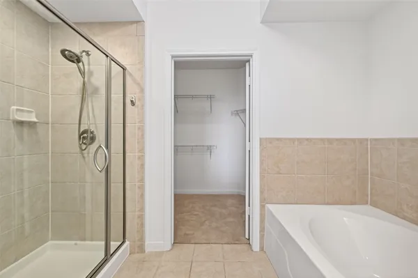 a bathroom with a bathtub and a shower