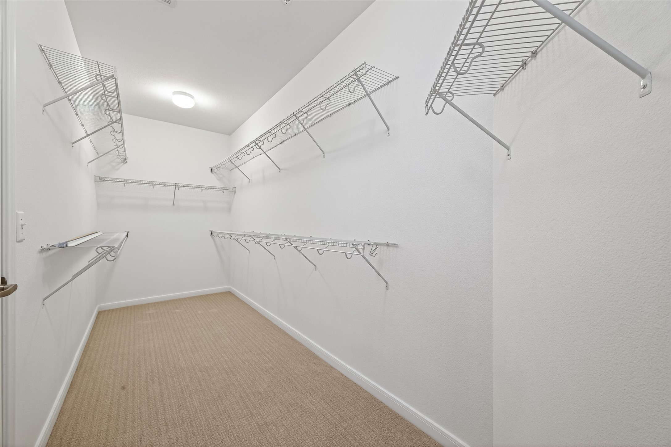 505 Jackson Hill Street, Unit 404 Houston, TX 77007 - Photo 15 of 24 a view of a room with racks on the wall