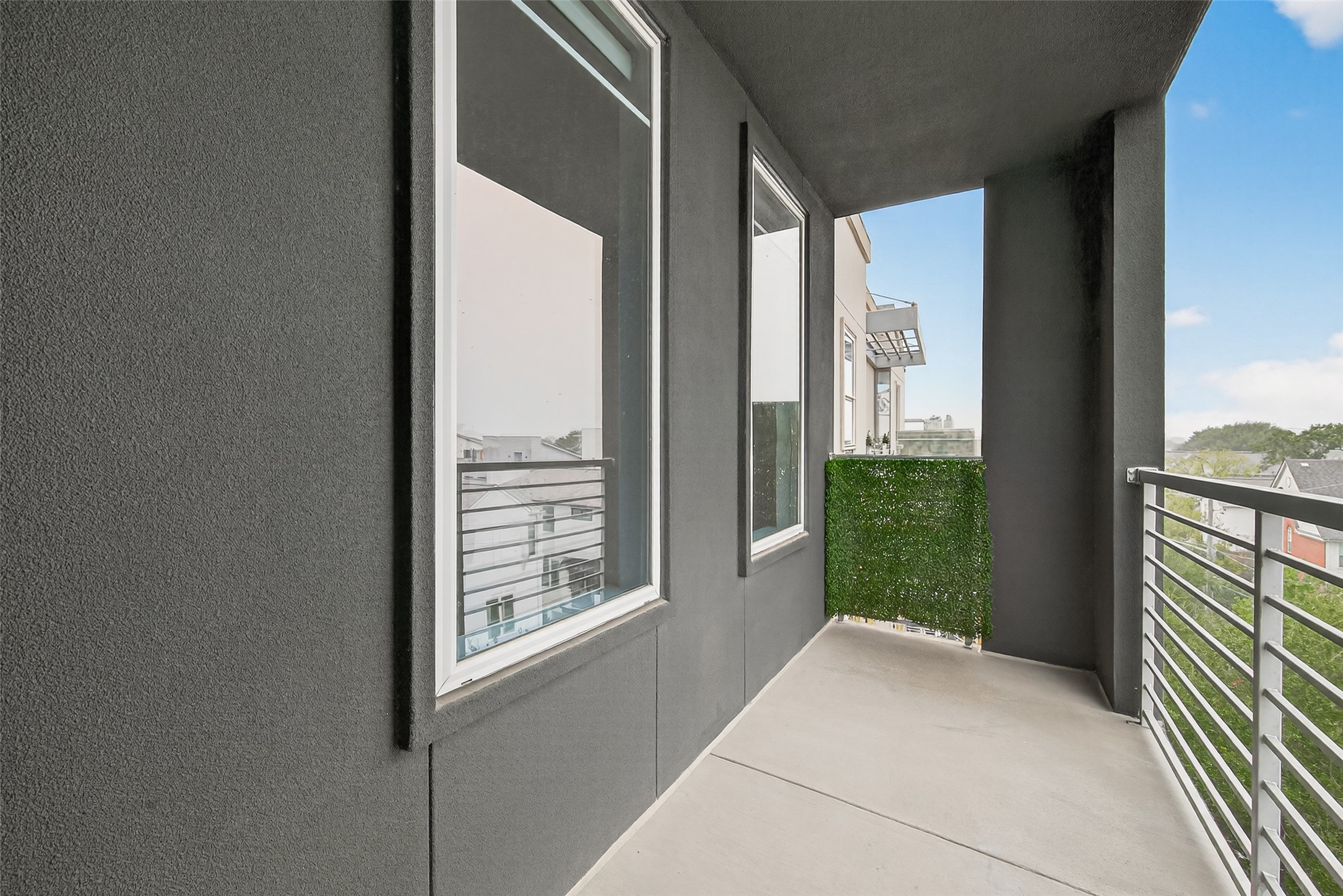 505 Jackson Hill Street, Unit 404 Houston, TX 77007 - Photo 22 of 24 a view of balcony with floor to ceiling window