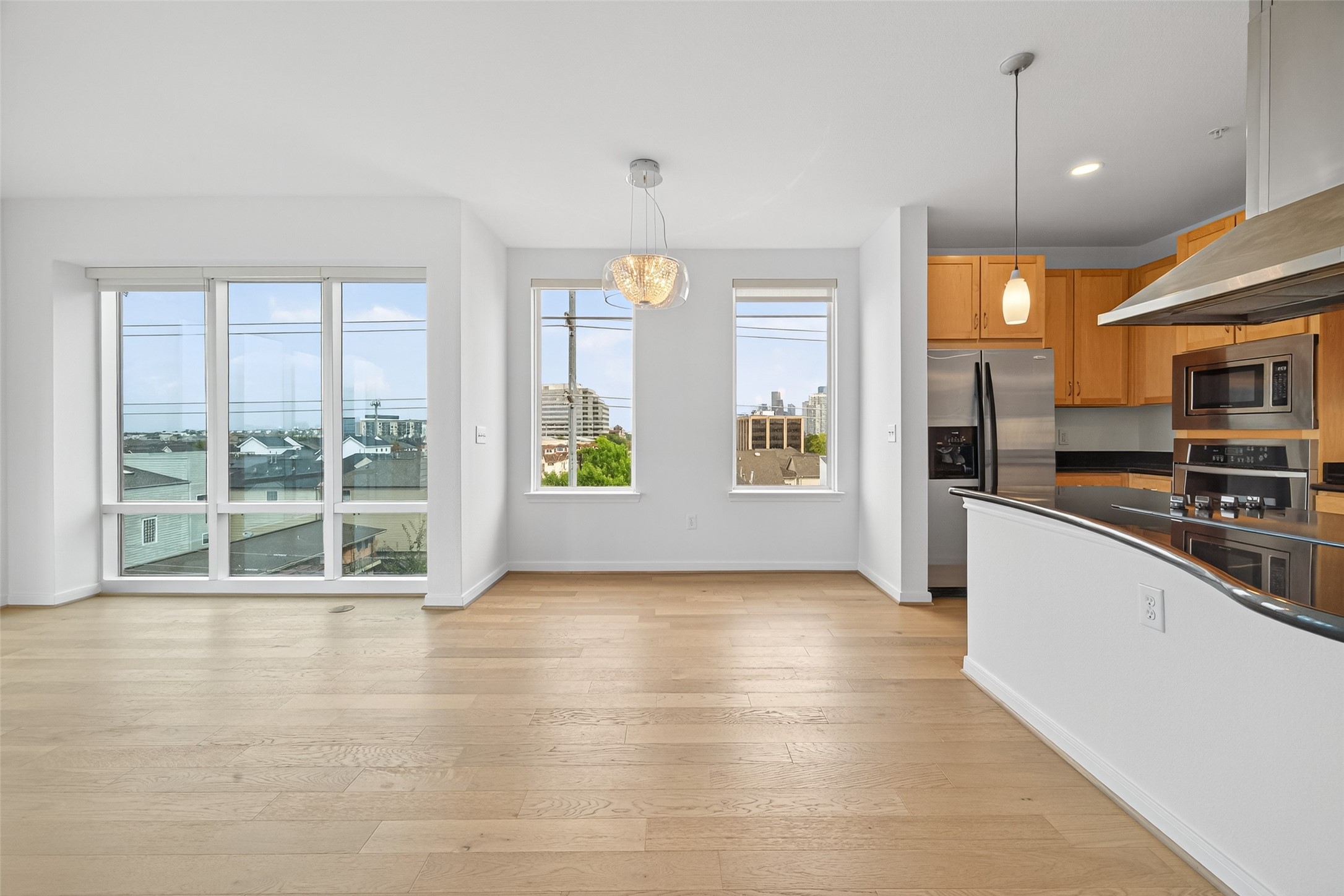505 Jackson Hill Street, Unit 404 Houston, TX 77007 - Photo 6 of 24 a view of an empty room with kitchen and window