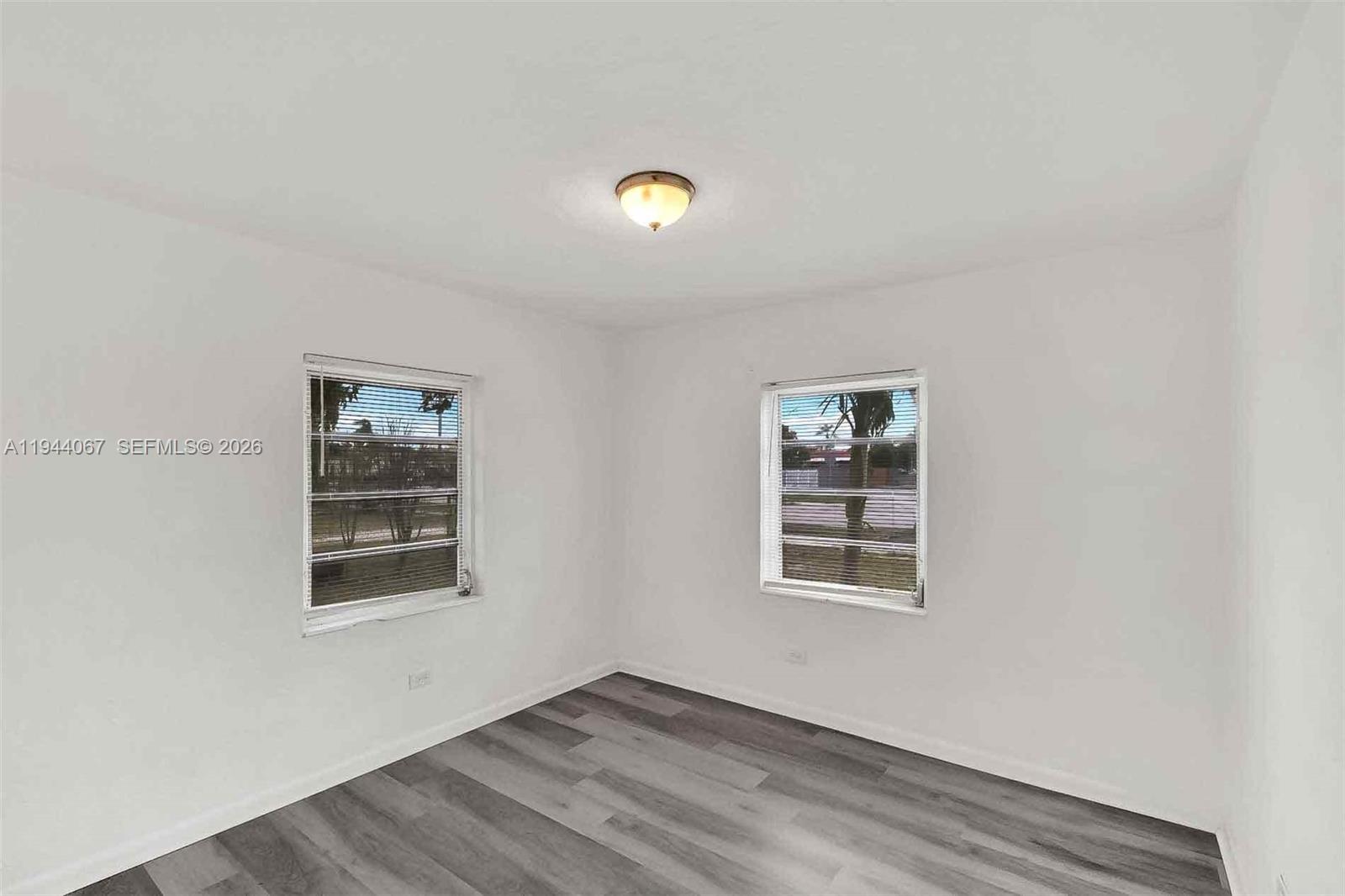 15351 Southwest 296th Street Homestead, FL 33033 - Photo 11 of 27 an empty room with windows
