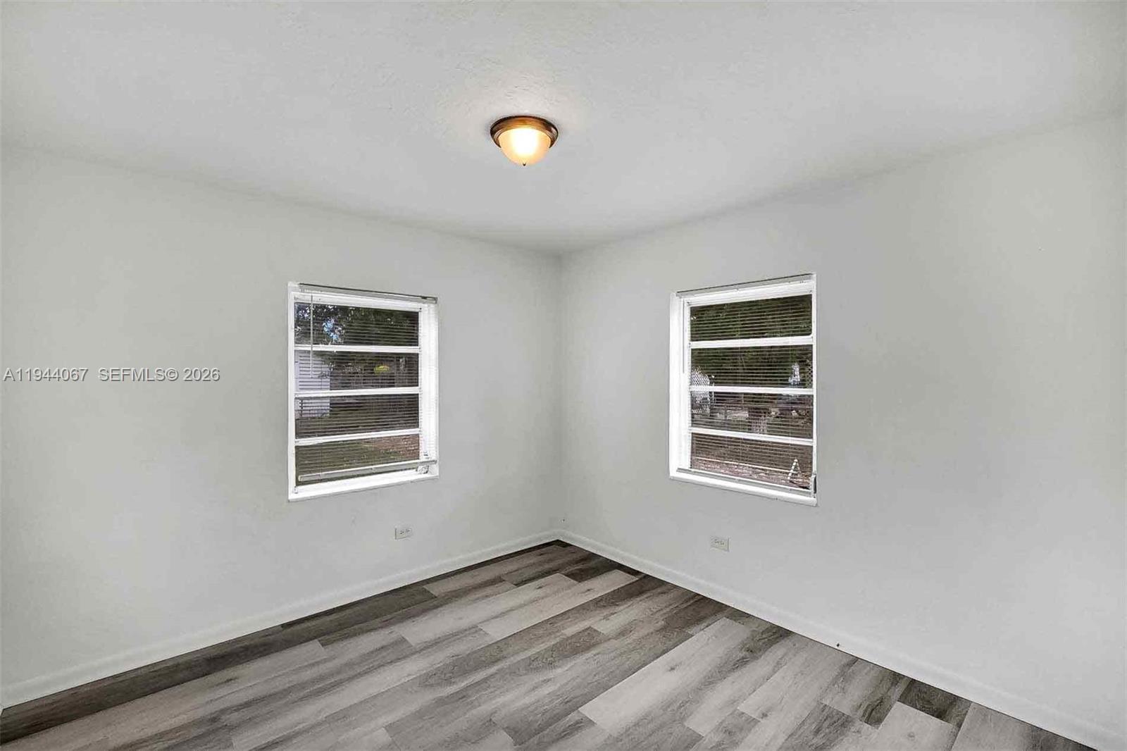 15351 Southwest 296th Street Homestead, FL 33033 - Photo 13 of 27 a view of empty room with windows