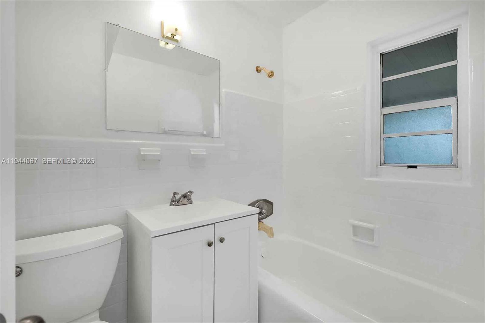 15351 Southwest 296th Street Homestead, FL 33033 - Photo 15 of 27 a bathroom with a sink a toilet and bathtub