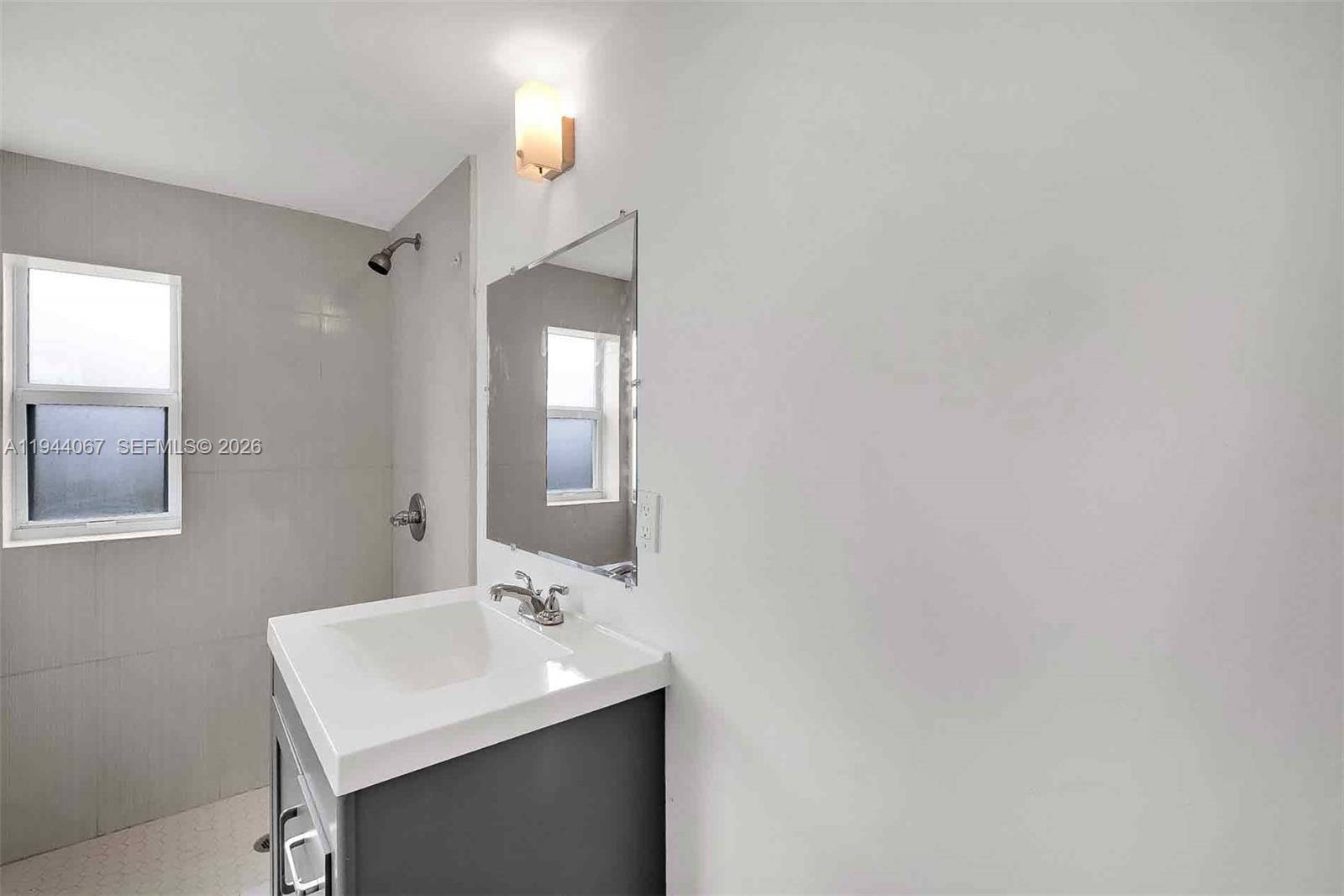 15351 Southwest 296th Street Homestead, FL 33033 - Photo 19 of 27 a bathroom with a sink and a mirror
