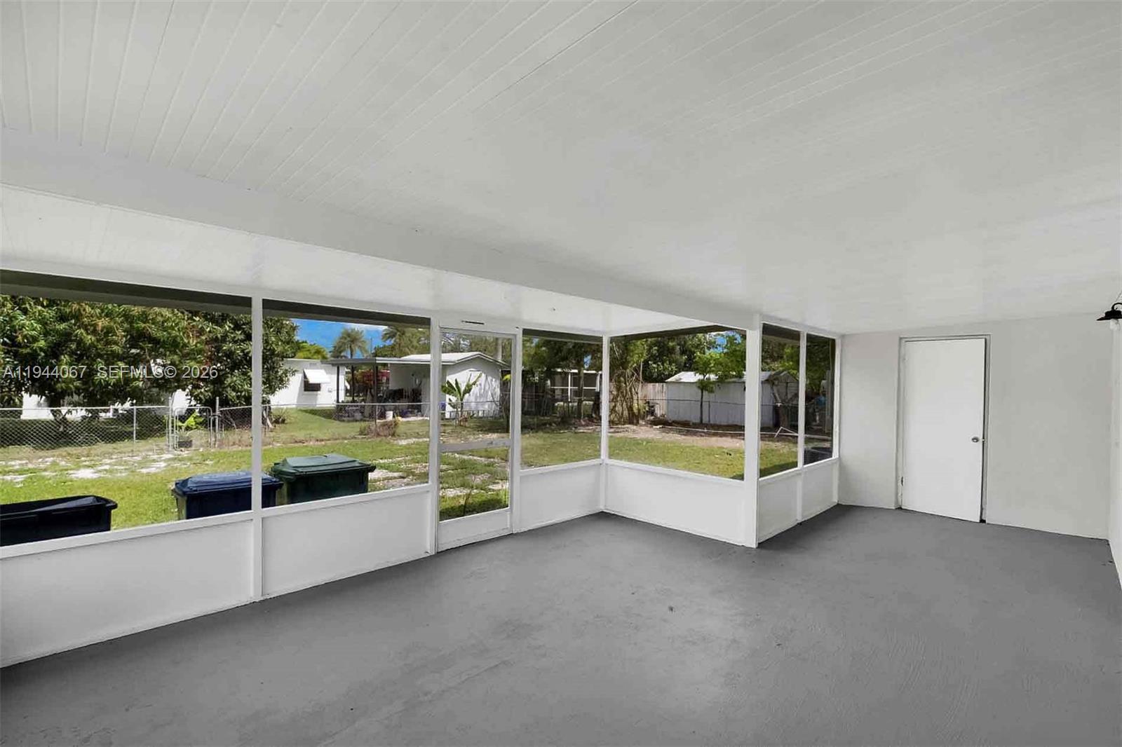 15351 Southwest 296th Street Homestead, FL 33033 - Photo 25 of 27 a swimming pool with an outdoor seating and yard