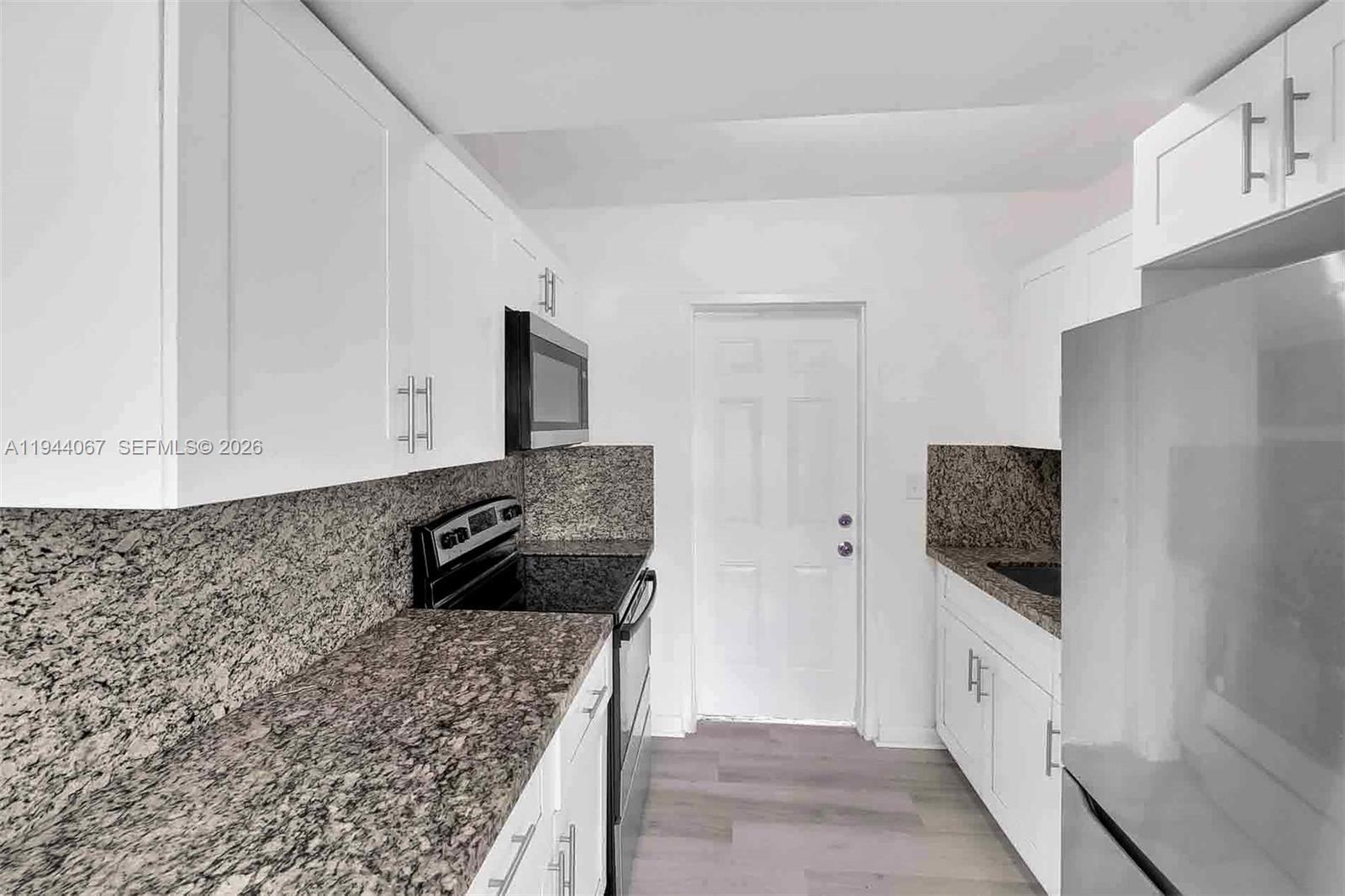 15351 Southwest 296th Street Homestead, FL 33033 - Photo 8 of 27 a bathroom with a granite countertop sink and a mirror
