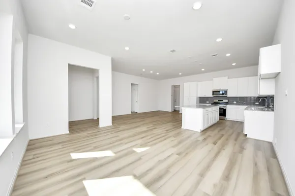 a view of kitchen with wooden floor