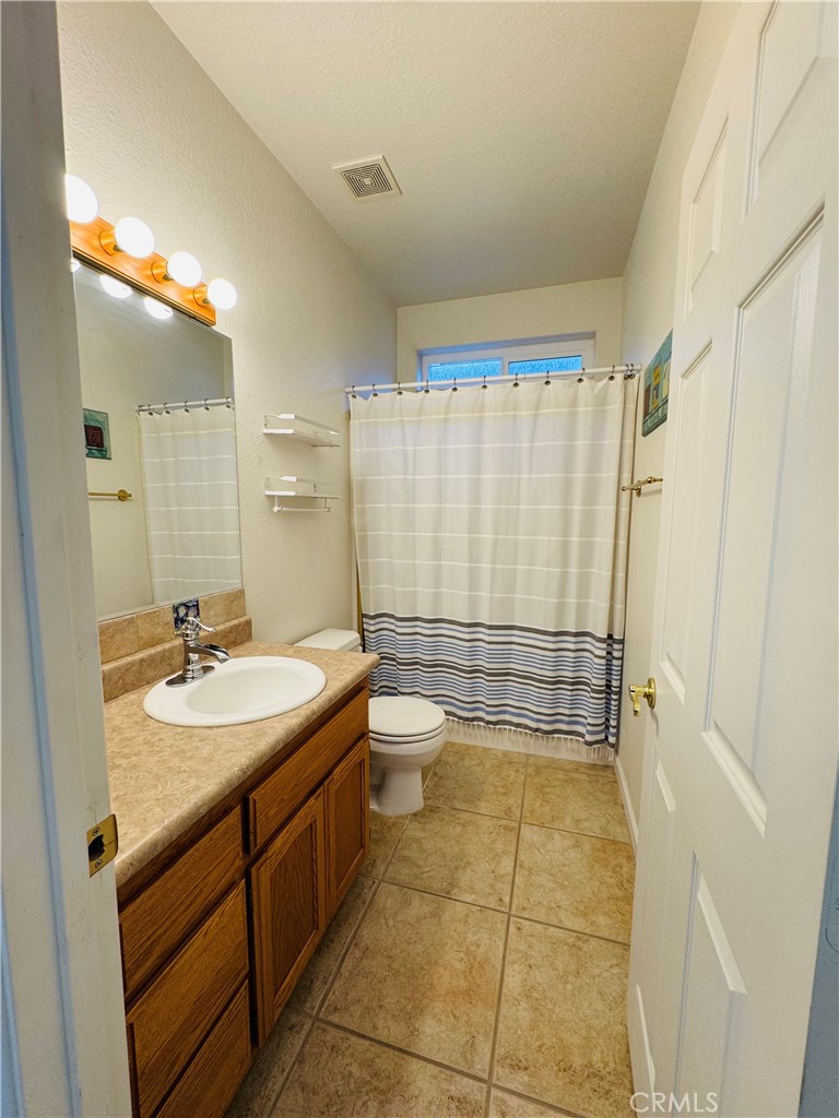 5770 Colorado River Road Blythe, CA 92225 - Photo 12 of 34 a bathroom with a sink a toilet and shower