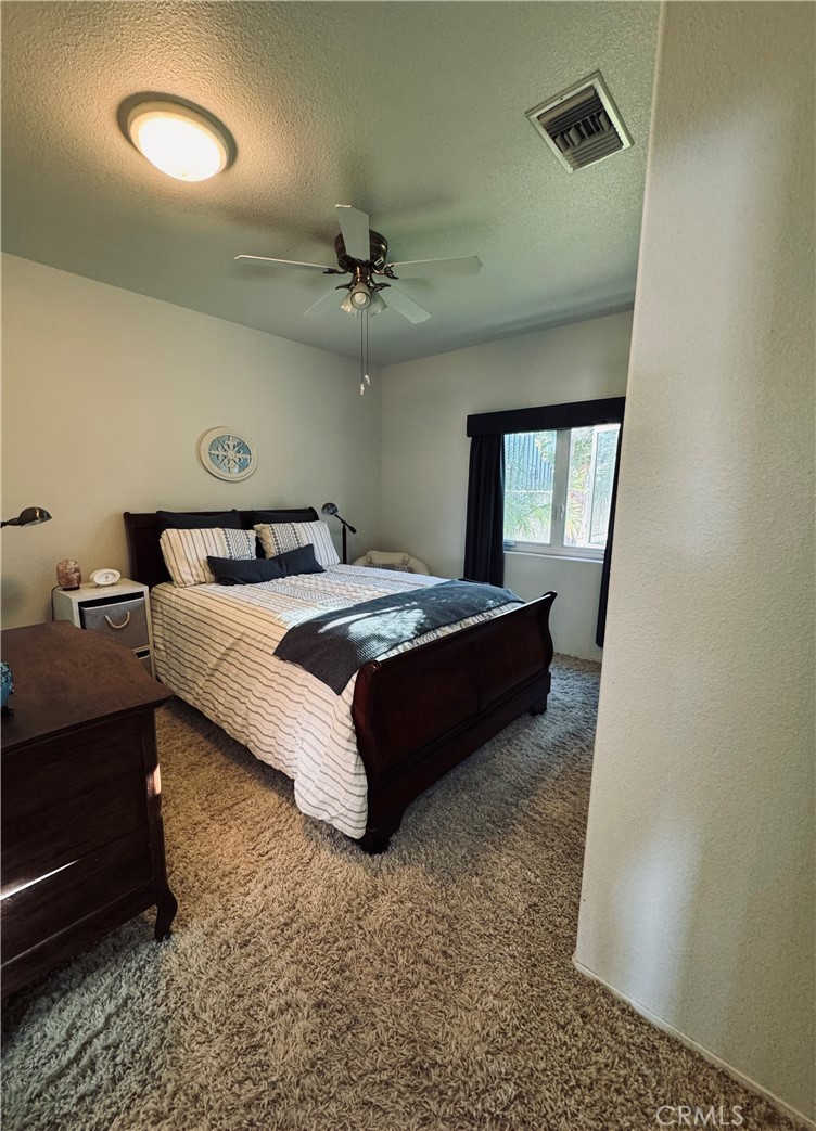 5770 Colorado River Road Blythe, CA 92225 - Photo 14 of 34 a bed room with a bed and a mirror