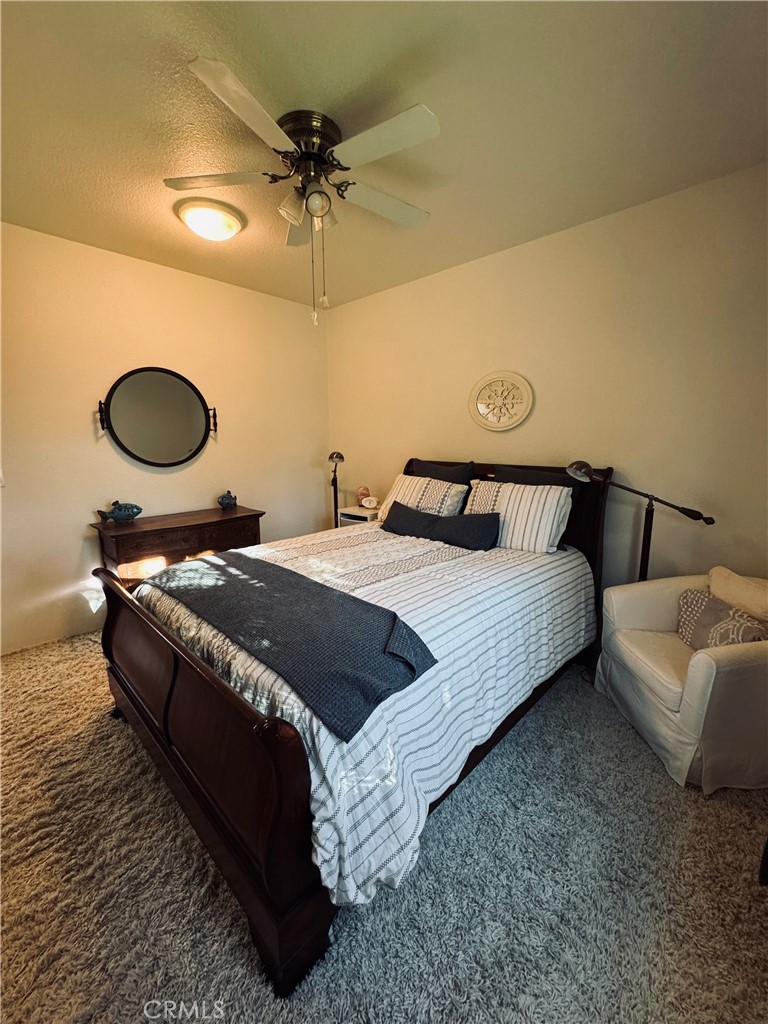 5770 Colorado River Road Blythe, CA 92225 - Photo 16 of 34 a bedroom with a bed and window