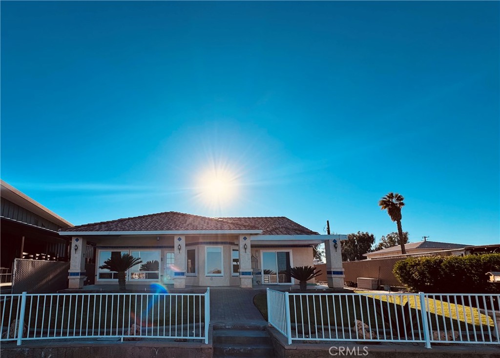 5770 Colorado River Road Blythe, CA 92225 - Photo 25 of 34 a front view of a house with a garden