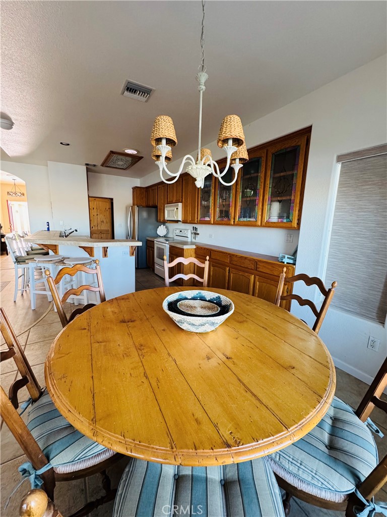 5770 Colorado River Road Blythe, CA 92225 - Photo 9 of 34 a view of a dining room with furniture and wooden floor