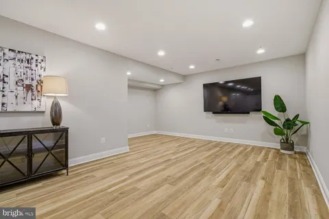 a living room with furniture a window and a table