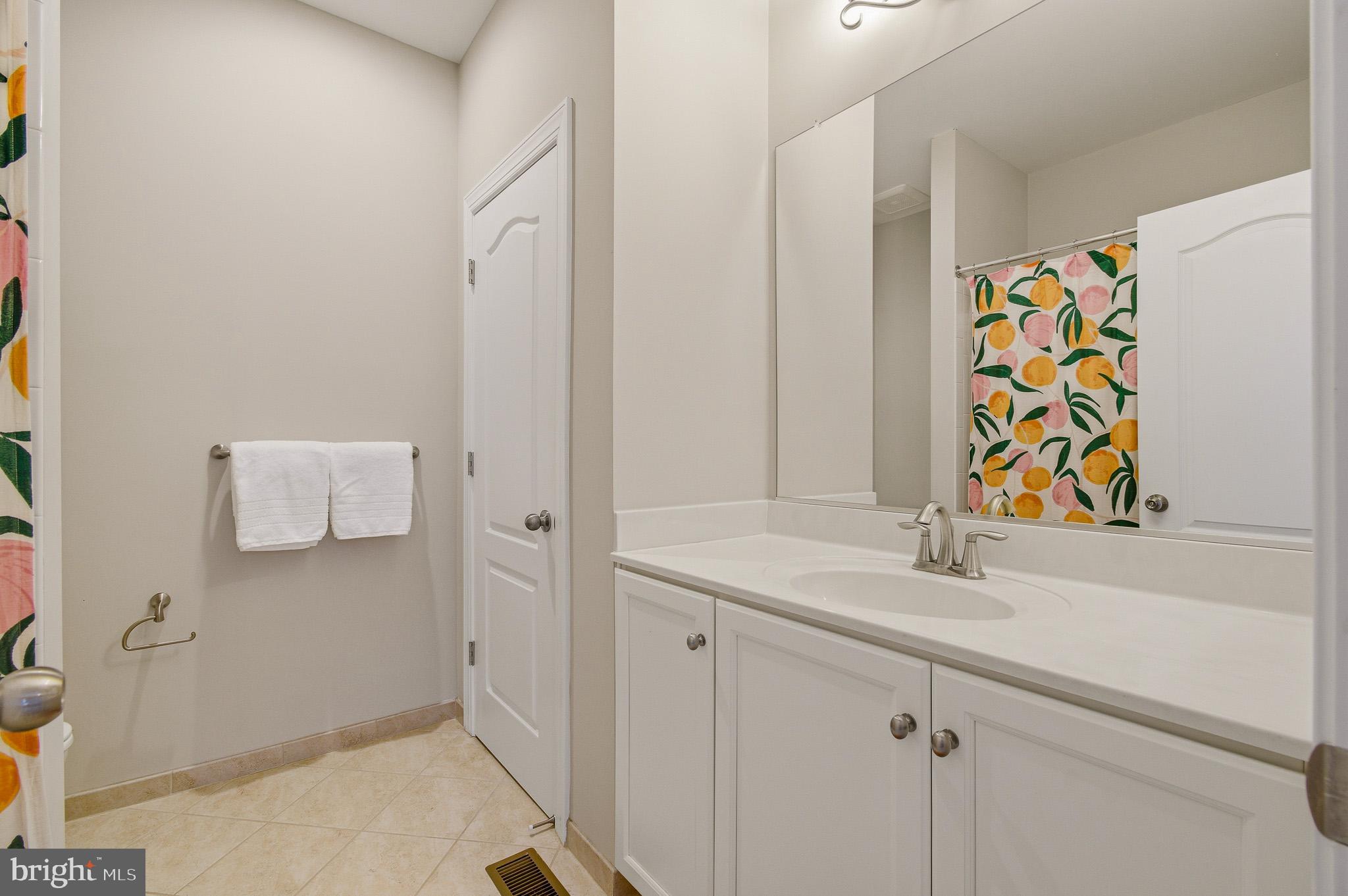805 Lower Barn Way Olney, MD 20832 - Photo 48 of 77 a bathroom with a sink and a mirror