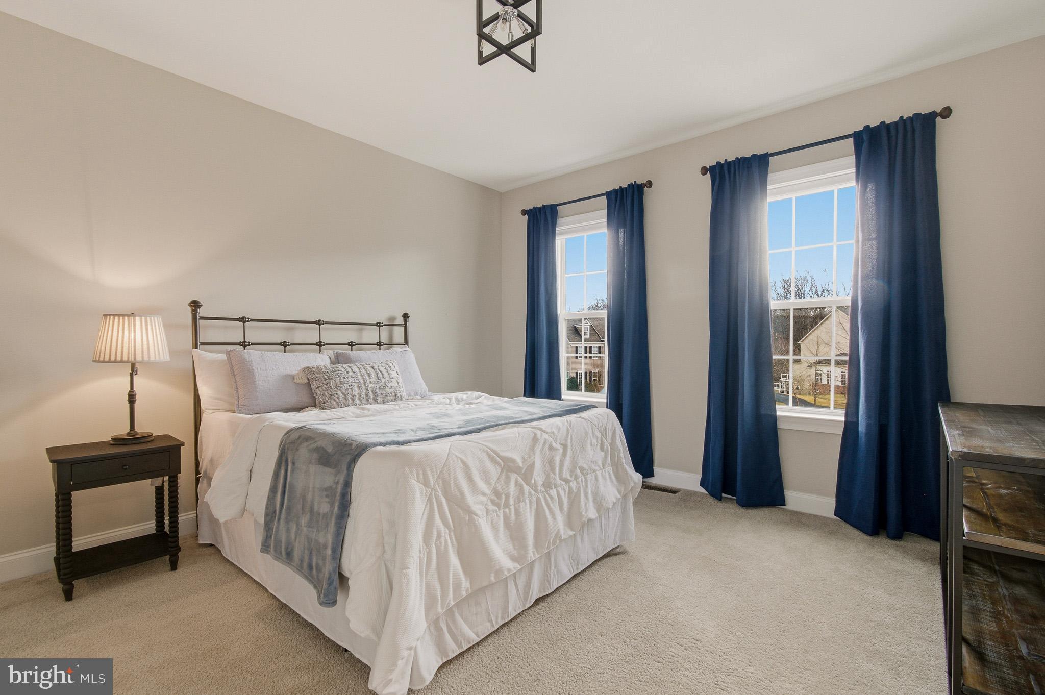 805 Lower Barn Way Olney, MD 20832 - Photo 57 of 77 a bedroom with a bed and a lamp