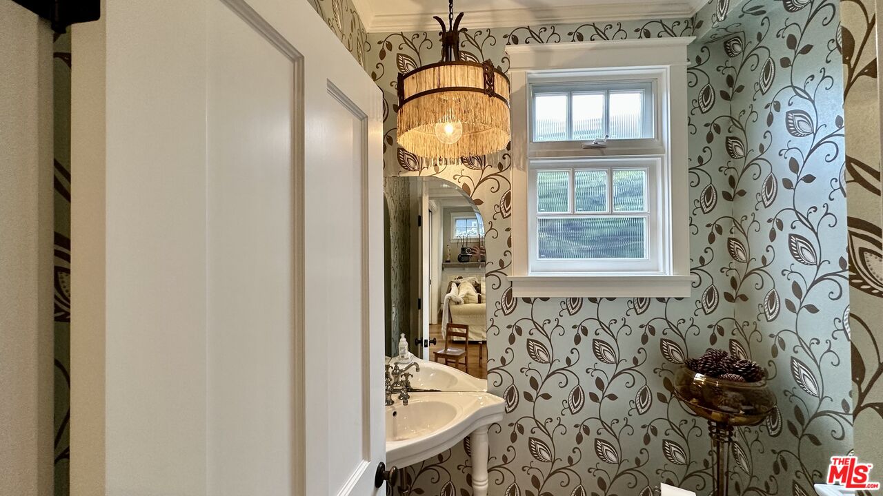 910 Marco Place Venice, CA 90291 - Photo 16 of 43 a bathroom with a sink and a mirror