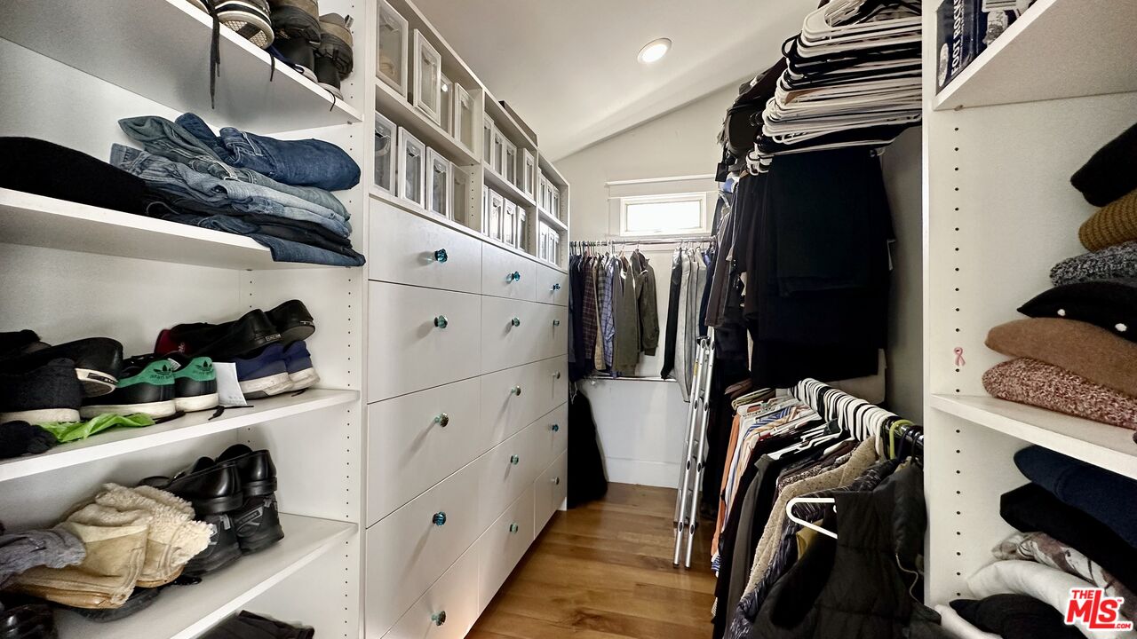 910 Marco Place Venice, CA 90291 - Photo 24 of 43 a view of walk in closet with clothes and shoes
