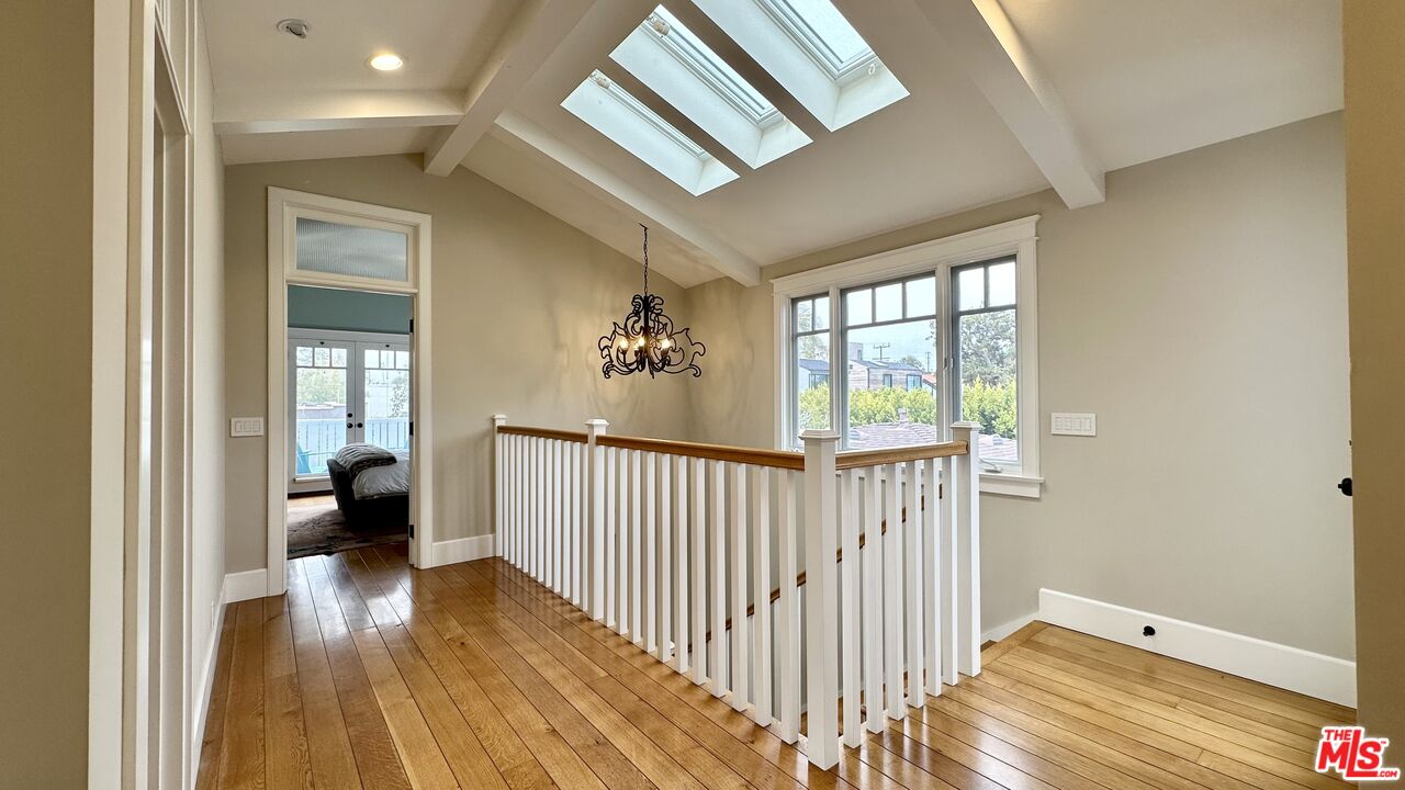 910 Marco Place Venice, CA 90291 - Photo 25 of 43 a view of a hallway view with wooden floor and staircase